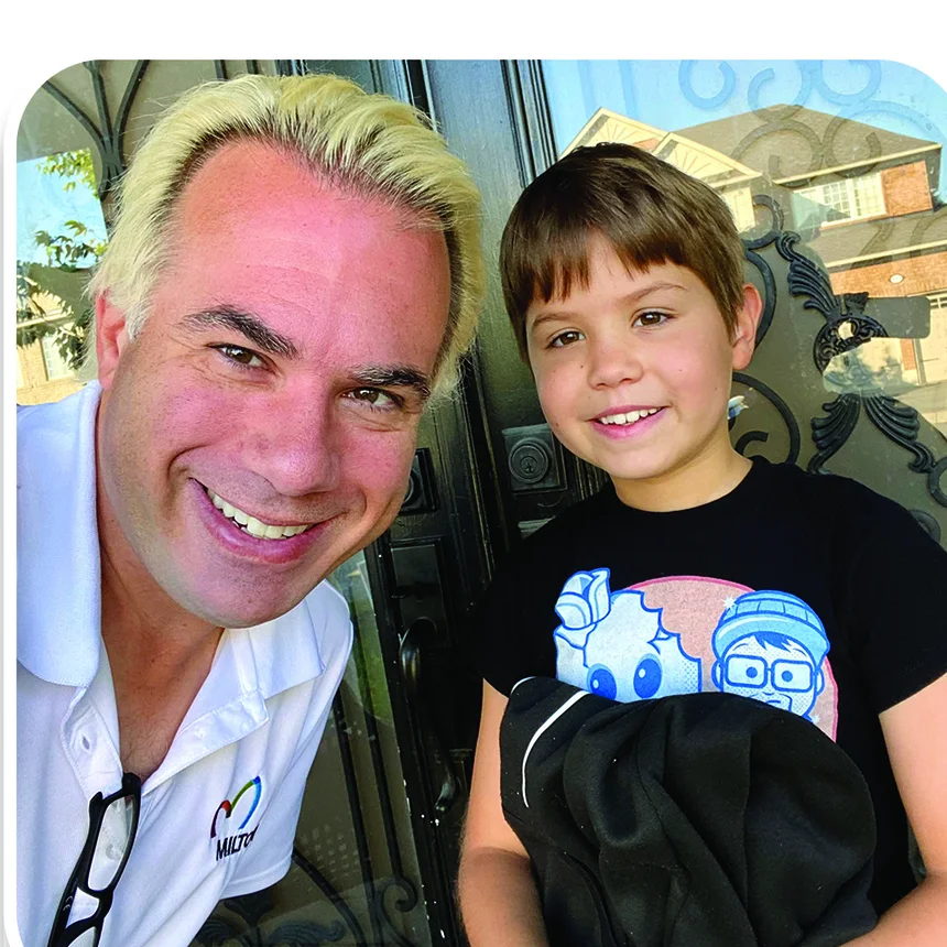 Rick Di Lorenzo with his son at their front door